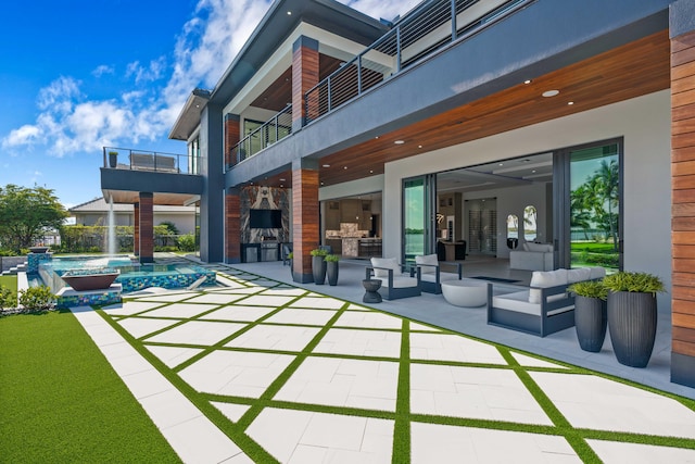 view of patio / terrace with an outdoor hangout area and a balcony