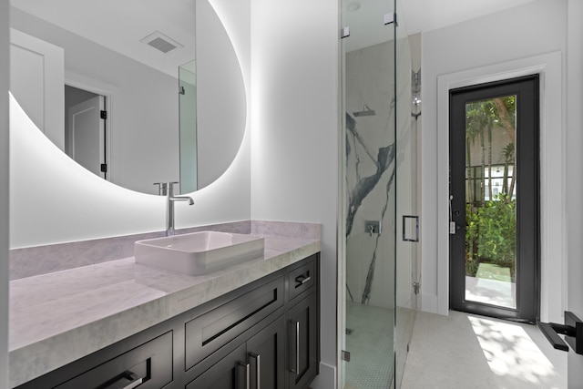 bathroom with a shower with door, vanity, and concrete floors