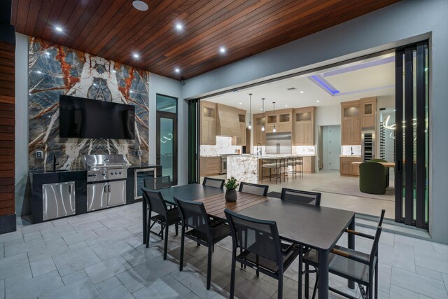 dining space with wood ceiling