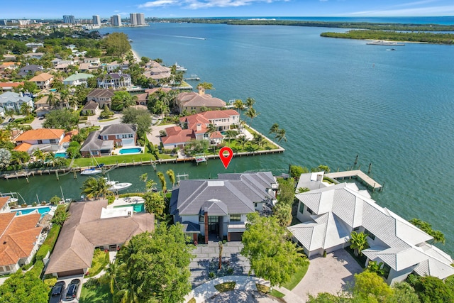 birds eye view of property with a water view