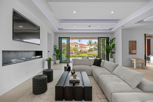 living room with a raised ceiling