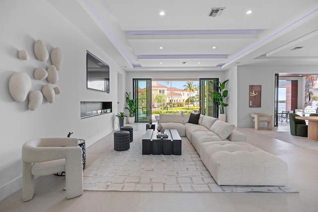 living room with a tray ceiling