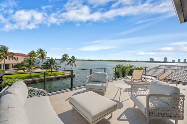 view of patio with a water view and a balcony