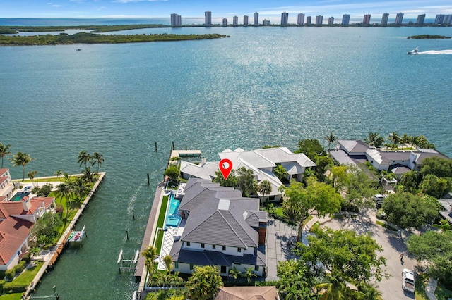 birds eye view of property with a water view