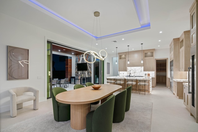 dining space with a chandelier and sink