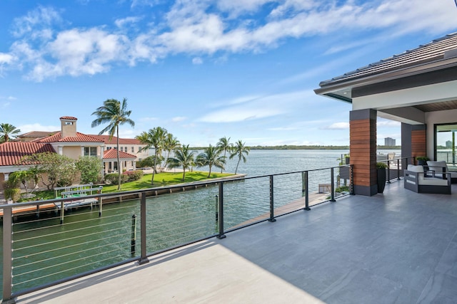 balcony featuring a water view