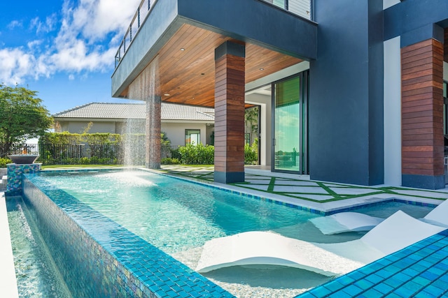 view of pool with pool water feature