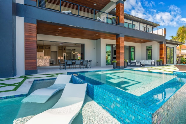 view of swimming pool with an outdoor living space and a patio area