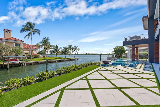 view of patio featuring a dock and a water view