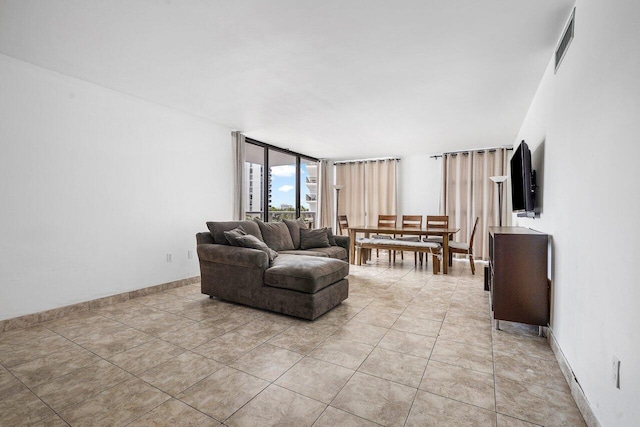 living room with light tile patterned flooring