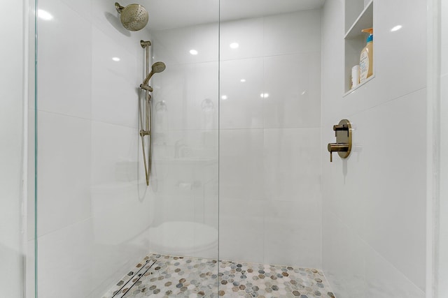 bathroom with tiled shower