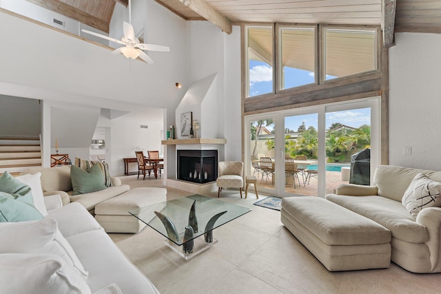 living room with beam ceiling, ceiling fan, high vaulted ceiling, and wood ceiling