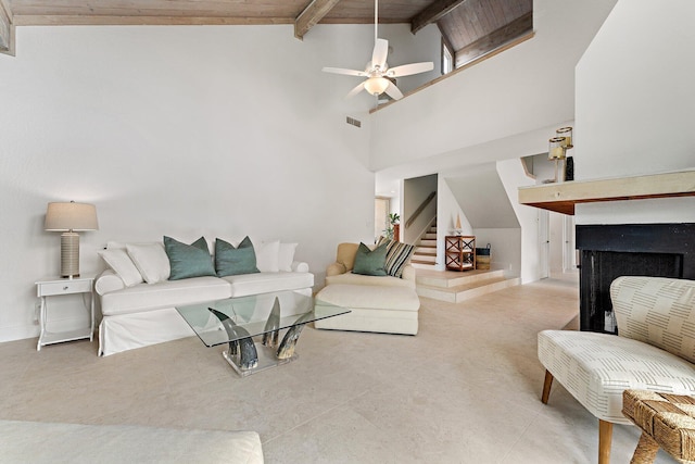 living room with beam ceiling, high vaulted ceiling, ceiling fan, and wooden ceiling