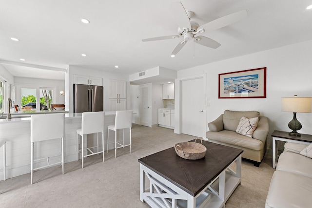 living room featuring ceiling fan