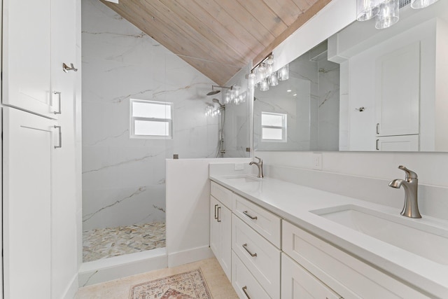 bathroom featuring a tile shower, tile patterned floors, vaulted ceiling, vanity, and wood ceiling