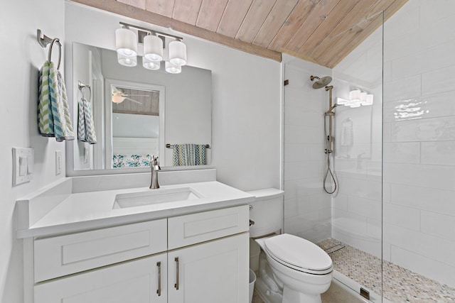 bathroom featuring vaulted ceiling, vanity, toilet, tiled shower, and wood ceiling