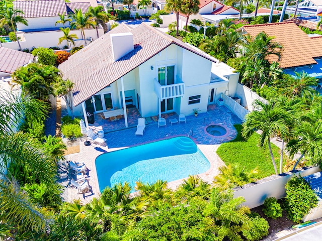 view of pool featuring an in ground hot tub and a patio