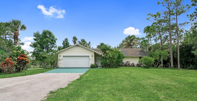 ranch-style house featuring a front lawn and a garage