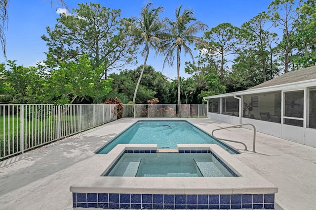 view of swimming pool with an in ground hot tub and a patio