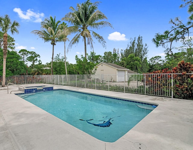 view of swimming pool featuring an in ground hot tub and a patio