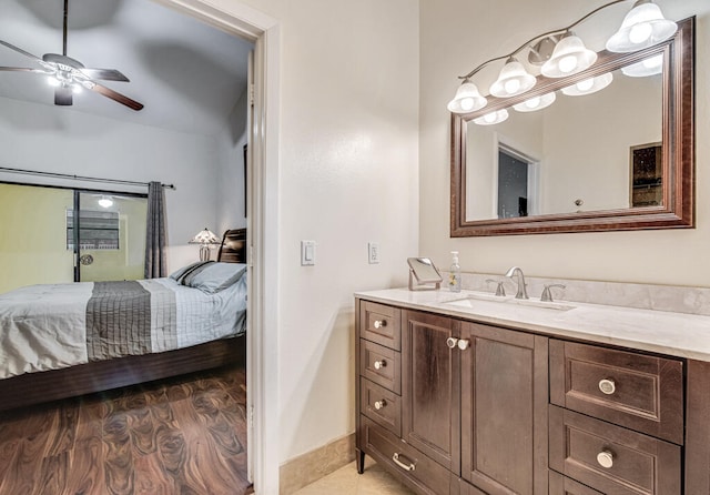 bathroom featuring hardwood / wood-style floors, ceiling fan, and vanity