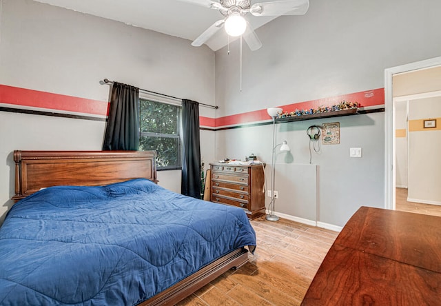 bedroom featuring light hardwood / wood-style flooring and ceiling fan