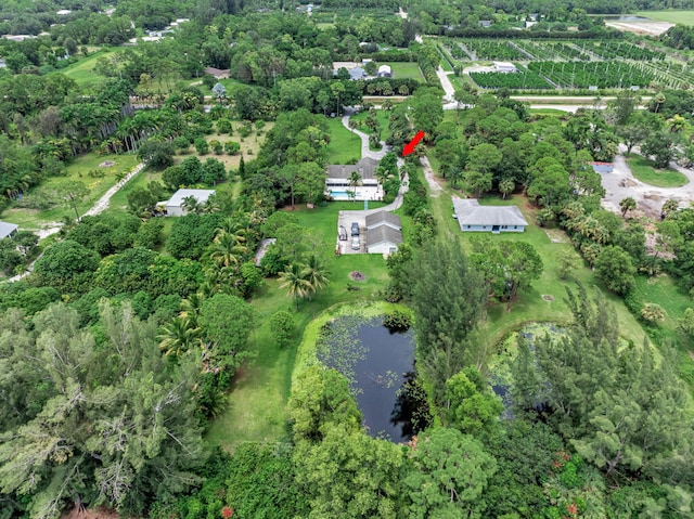 aerial view with a rural view and a water view