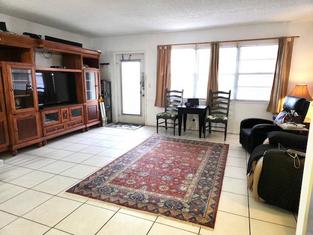 tiled living room with a textured ceiling