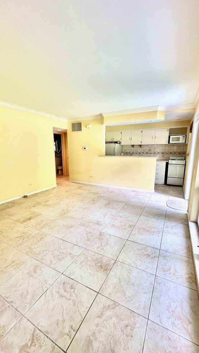 unfurnished living room with ornamental molding