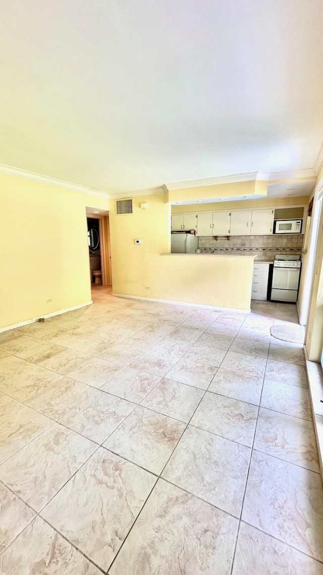 414 Seasage Dr Unit 3, Delray Beach, FL 33483 - unfurnished room with baseboards, visible vents, and crown molding