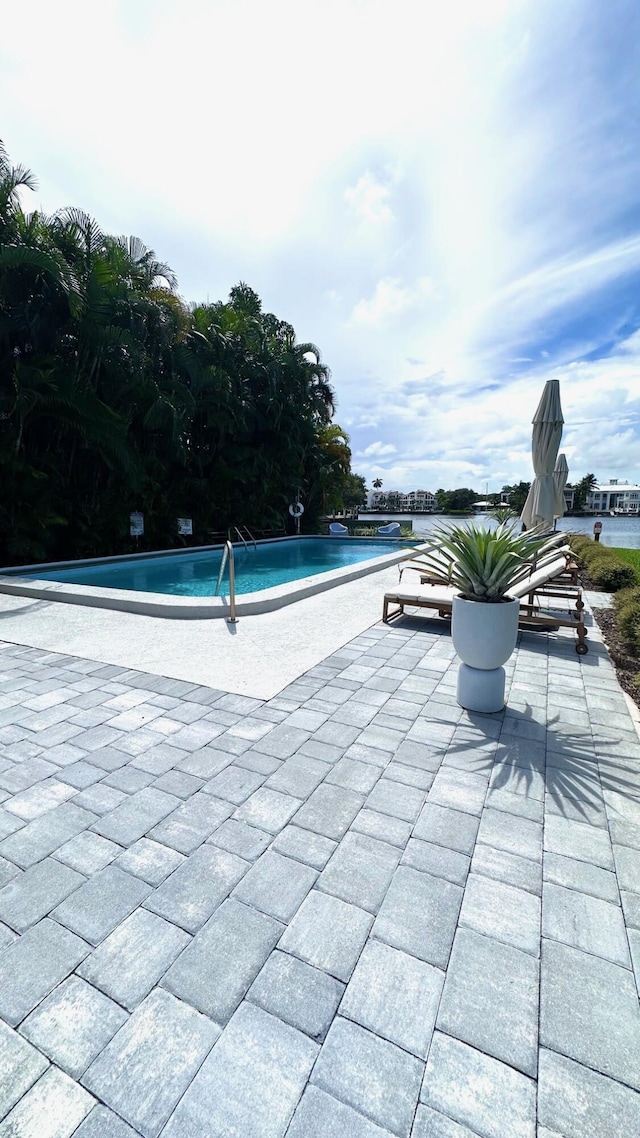 414 Seasage Dr Unit 3, Delray Beach, FL 33483 - pool featuring a patio area