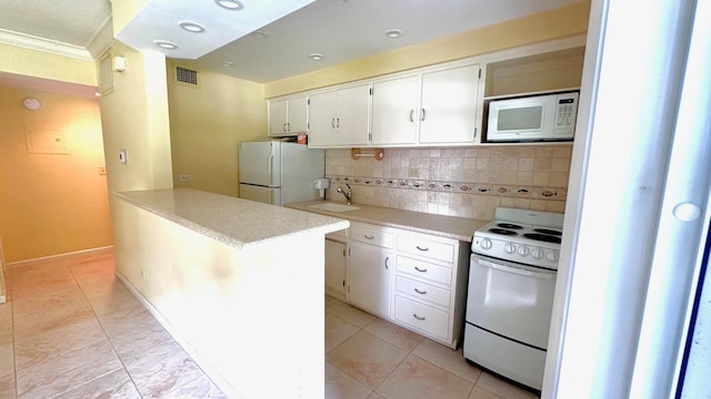 kitchen featuring crown molding, white appliances, white cabinetry, backsplash, and sink