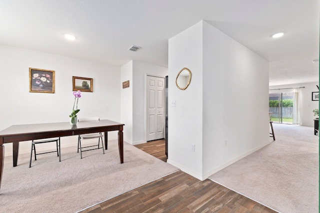 dining area featuring dark wood-type flooring