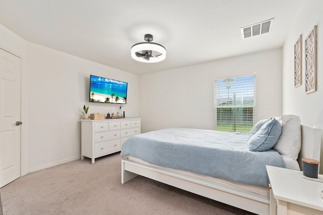 bedroom with light carpet