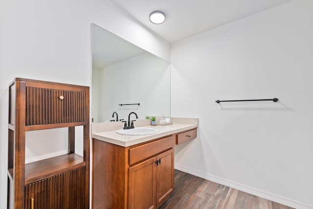 bathroom featuring hardwood / wood-style flooring and vanity