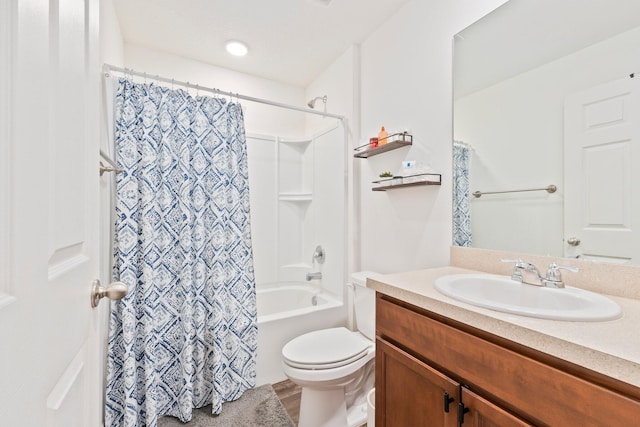 full bathroom with wood-type flooring, vanity, toilet, and shower / bathtub combination with curtain