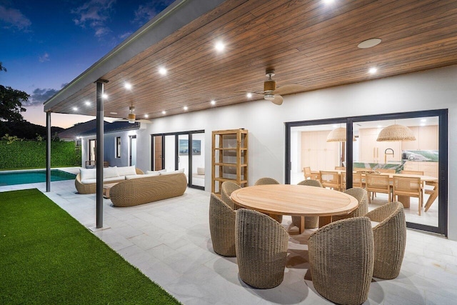 exterior space with ceiling fan and an outdoor hangout area