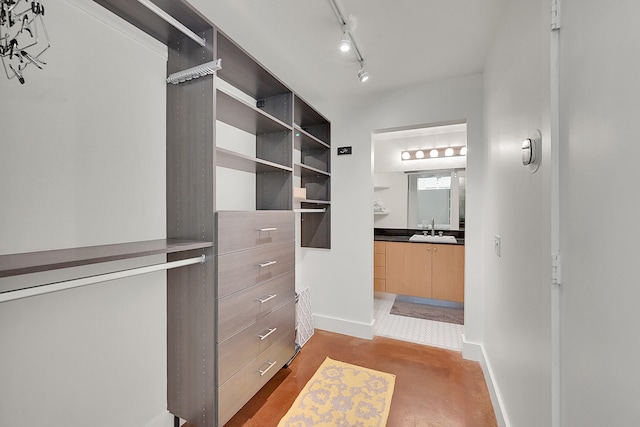 spacious closet featuring sink