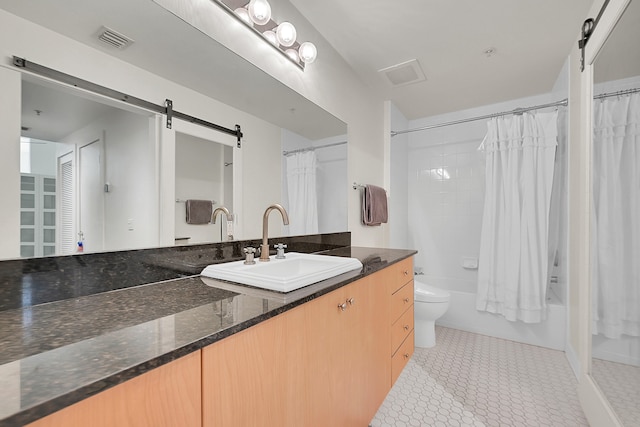 full bathroom featuring vanity, toilet, and shower / tub combo