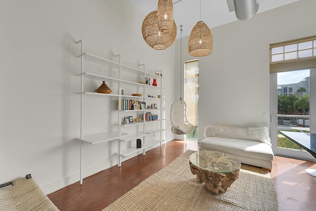 living area with a high ceiling