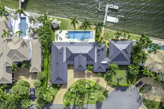 birds eye view of property with a water view