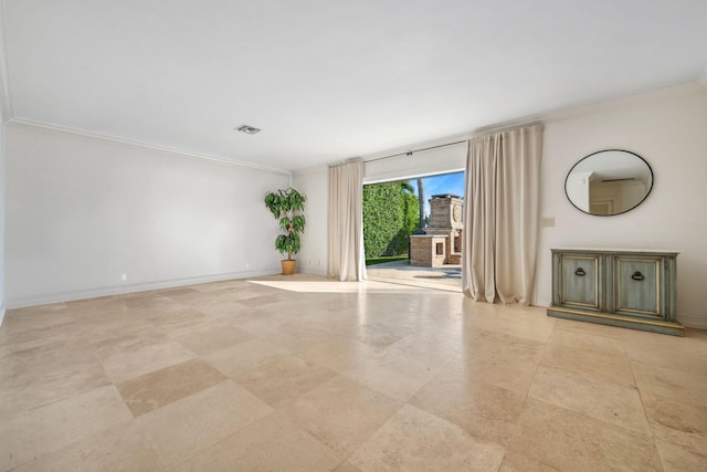 unfurnished living room with visible vents, crown molding, and baseboards