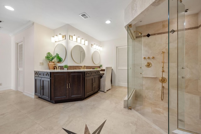 bathroom with double vanity, a stall shower, baseboards, visible vents, and recessed lighting