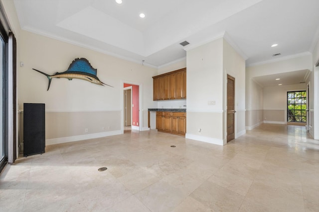 unfurnished living room with baseboards, visible vents, ornamental molding, and recessed lighting