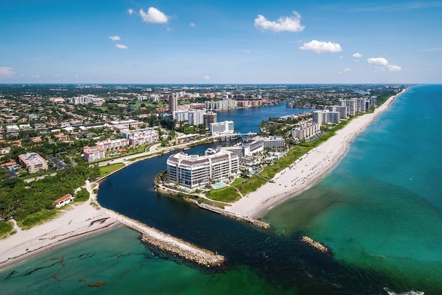 drone / aerial view featuring a beach view and a water view