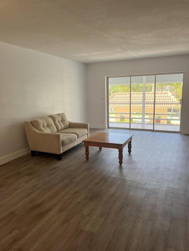 unfurnished living room featuring dark hardwood / wood-style floors