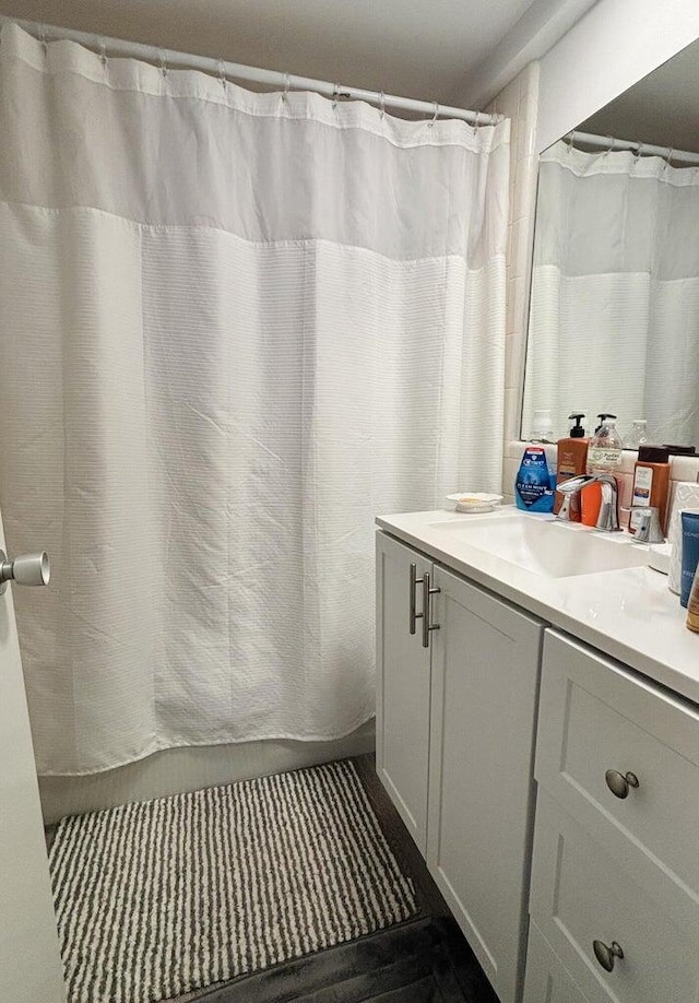 bathroom with vanity and walk in shower