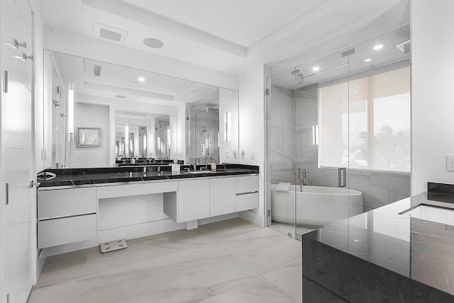 bathroom featuring a freestanding tub, visible vents, vanity, marble finish floor, and a stall shower