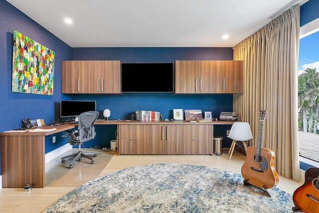 office featuring light tile patterned floors, built in desk, and recessed lighting