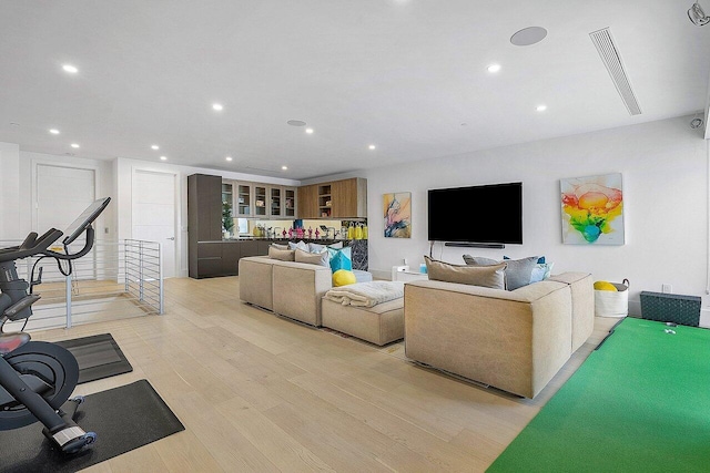 living room featuring recessed lighting and light wood-style flooring